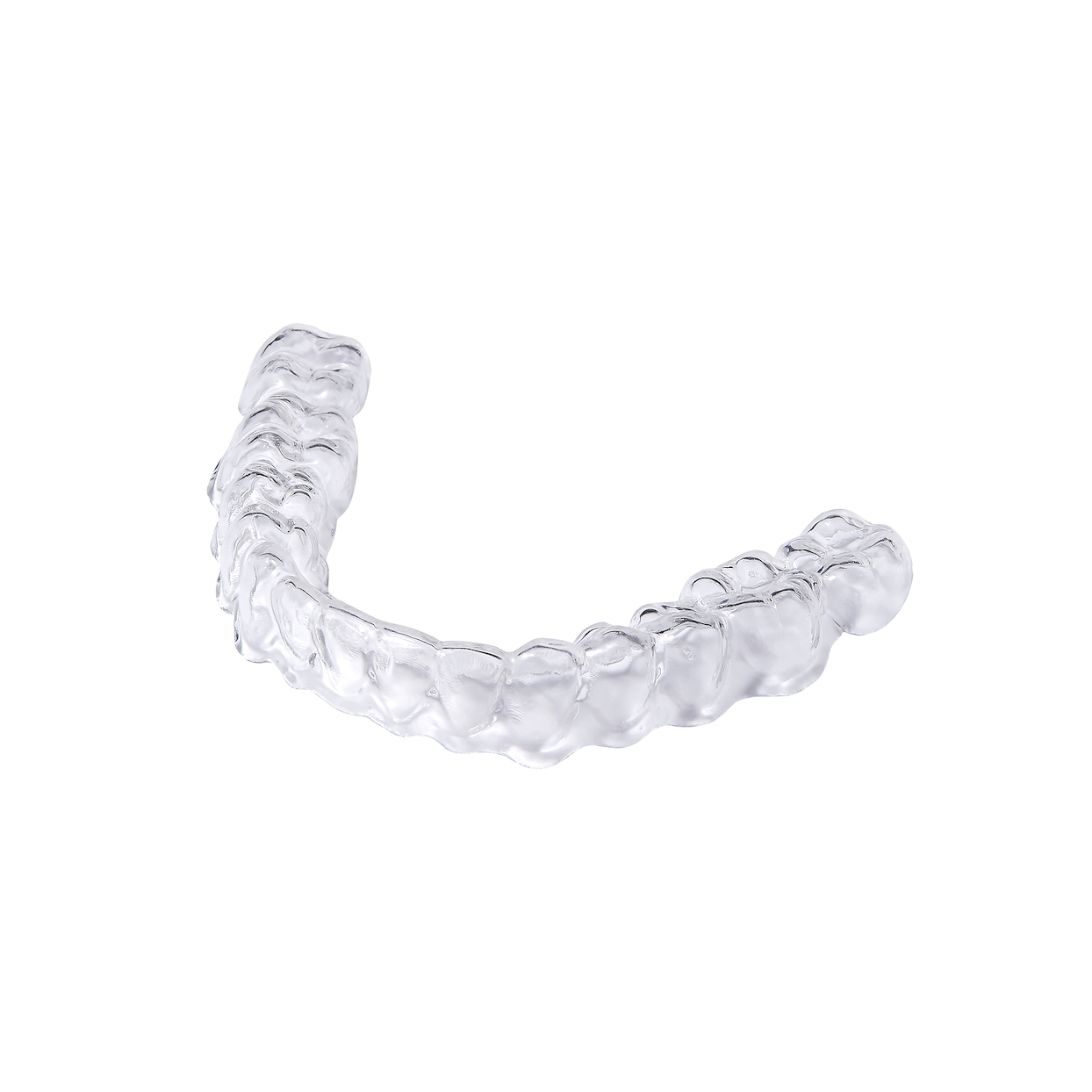 A directly printed clear aligner shown with its print supports before finishing